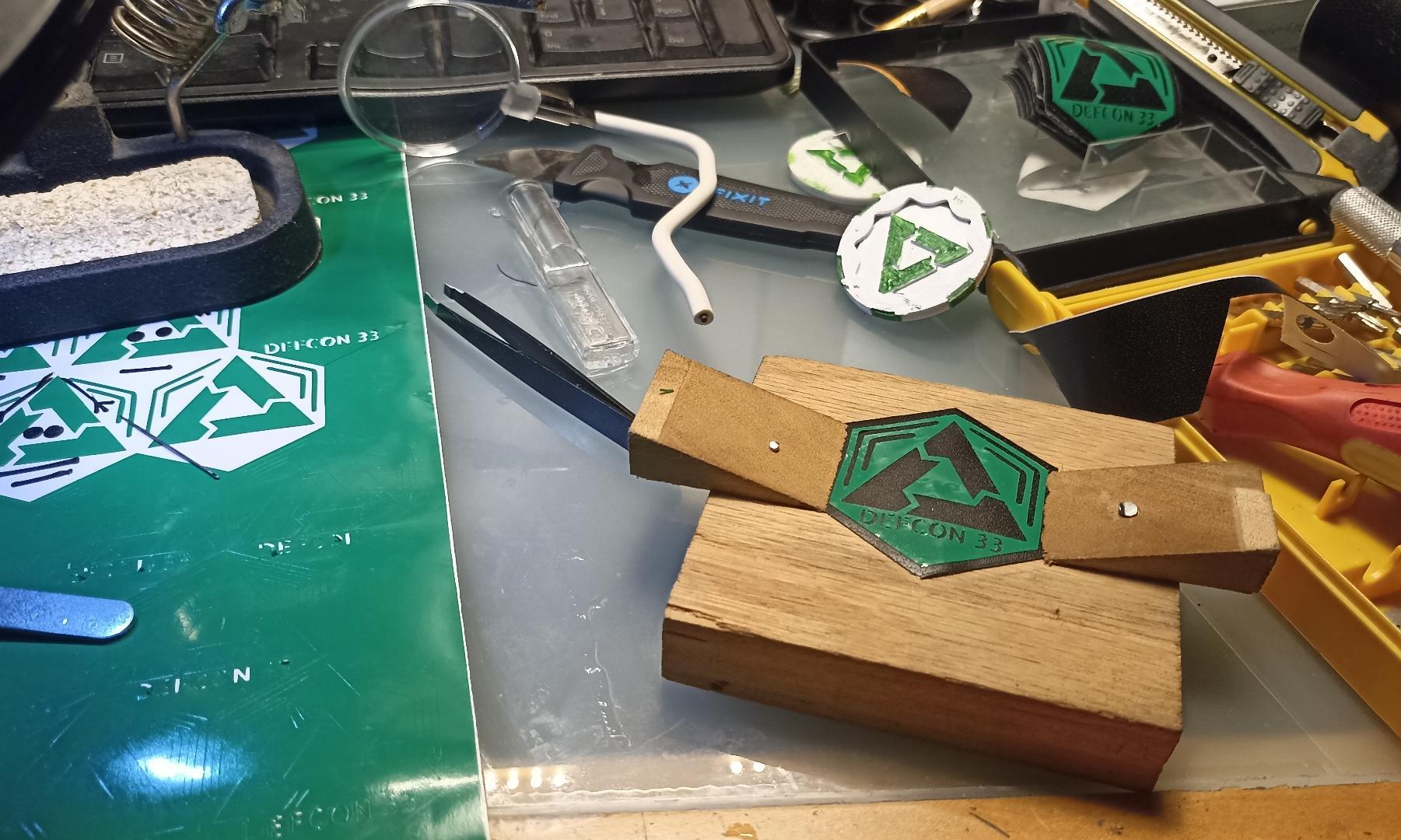 Stickers and maker coins made by Ranny for DEF CON 33, initially posted here: https://social.garudalinux.org/@RannyBergamotte/114951573333227576