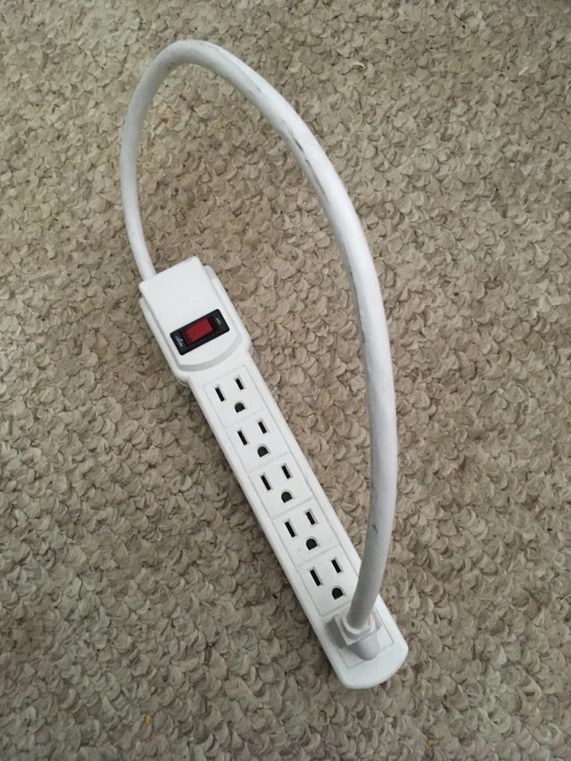 surge protector strip owned by a genius generating unlimited power (strip plugged into itself)